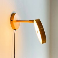 Dyberg Larsen Starlight LED wall lamp, yellow, Ø 14 cm, dimmable.