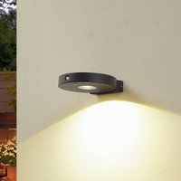 Lucande LED solar wall lamp Tavon, round, black, sensor