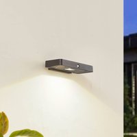Lucande LED solar wall light Tavon, angular, black, sensor