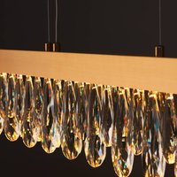 Brilliant Suspension LED Celestia, longueur 110 cm, cristal couleur laiton