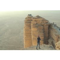 Edge of the World with 4x4 vehicle, camels and stargazing