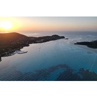 Sunset aperitif on a catamaran in the Asinara island park