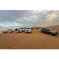 Red Dune Desert Safari Camel Ride, Sandboarding with BBQ Dinner
