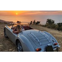 Cefalù and surroundings on a vintage car with hair in the wind