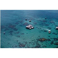Diving in the crystal clear waters in the Parrachos of Maracajaú