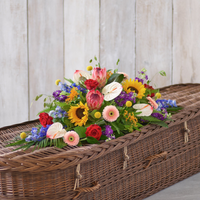 Natural Vibrance Casket Spray at Interflora Flowers Natural Vibrance Casket Spray.