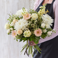 Sympathy hand-tied made with the finest flowers at Interflora Flowers Sympathy hand-tied made with the finest flowers.