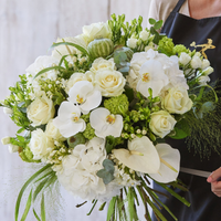 Sympathy hand-tied made with the finest flowers at Interflora Flowers Sympathy hand-tied made with the finest flowers.