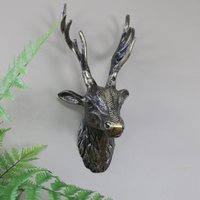 Melody Maison Antique Gold Metal Wall Mounted Stag Head in Metallic Gold