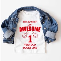 60 SECOND MAKEOVER This is What An Awesome 1 Year Old Looks Like T-Shirt in White | Size: 12-18 m