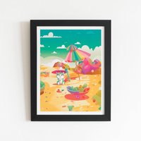 Warren Reed - Designer Kitten On A Beach Holiday Framed Art Print in Black | Size: W24" x H36"