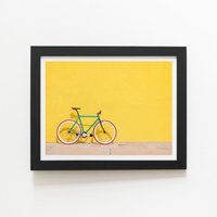 Warren Reed - Designer Bike Against Yellow Framed Art Print in Black | Size: W8" x H10"