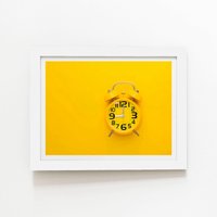 Warren Reed - Designer Yellow Alarm Clock Framed Art Print in White | Size: W24" x H36"