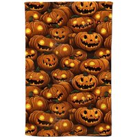 Warren Reed - Designer Grinning Lanterns Pumpkins With Glowing Eyes Tea Towel in Orange