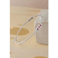 Otis Jaxon London Women's Triple Stone Garnet & Ruby Gold Birthstone Bangle in Silver