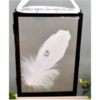Amaya Rose Ltd In Memory of Baby. Baby Feet Real feather Floating Picture Frame in Black