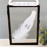 Amaya Rose Ltd Our Angel In Memory of Real feather Floating Picture Frame. Memorial in Black