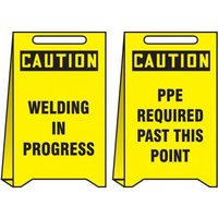 Accuform PFE428 20"" x 12"" OSHA Caution Reversible Fold-Up Floor Sign: Welding in Progress - PPE Required Past This Point
