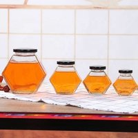 high quality Customized capacity glass honey jar Hexagon Honey Jar Glass with metal lid