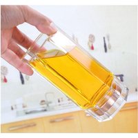 Handling Glass honey jars with spoon and mini jars of honey