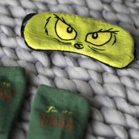 Click to view product details and reviews for The Grinch Sleep Mask And Sock Set. Click to view product details and reviews for The Grinch Sleep Mask And Sock Set.