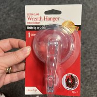 Click to view product details and reviews for Wreath Hanger With Suction Clamp In Clear Plastic. Click to view product details and reviews for Wreath Hanger With Suction Clamp In Clear Plastic.
