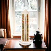 Click to view product details and reviews for Ivory Pillar Advent Candle On Glass Plate With Festive Decorations. Click to view product details and reviews for Ivory Pillar Advent Candle On Glass Plate With Festive Decorations.