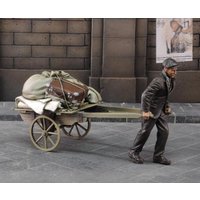 Evacuee pulling cart