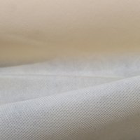 Intissé Spun fête déperlant aspect tissu uni écru - Mondial Tissus