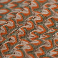 Tissu dentelle polyester crochet bourgeon orange - Mondial Tissus
