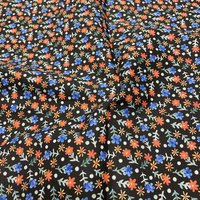 Tissu voile de coton doux noir fleurs en folie multico - Mondial Tissus