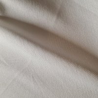 Entoilage thermocollant léger bi-élastique écru 150cm - Mondial Tissus