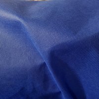 Intissé Spun fête déperlant aspect tissu uni bleu roi - Mondial Tissus