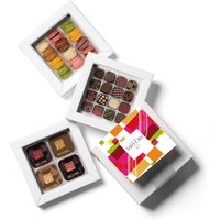 Box of gourmet treats, 32 plain and filled chocolates and 12 mini-macarons. High-end products presented in an elegant gift box.