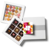 Box of gourmet treats, 36 plain chocolates and 25 mini-macarons. High-end products presented in an elegant gift box.