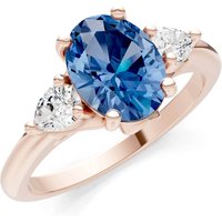 London Blue Topaz and Diamond Trellis Three Stone Oval and Pear Ring in 9ct Rose Gold