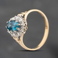 Second Hand 9ct Yellow Gold Blue Topaz & 0.05ct Diamond Heart Engraved Shoulders Oval Cluster Ring 43451021