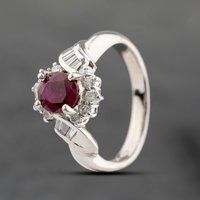 Pre-Owned Platinum 1.04ct Ruby and 0.27ct Diamond Oval Cluster Ring 43351046