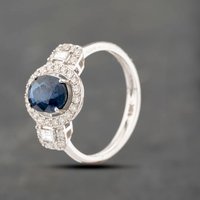 Pre-Owned 18ct White Gold Sapphire and 0.57ct Diamond Halo Oval Cluster Ring 43361141