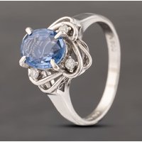 Pre-Owned Platinum 1.98ct Sapphire and 0.10ct Diamond Cluster Ring 43361153