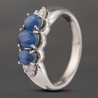 Pre-Owned Platinum 2.50ct Cabouchon Cut Star Sapphire and 0.13ct Diamond Three Stone Ring 43361158