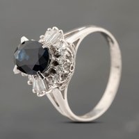 Pre-Owned Platinum 2.20ct Sapphire and 0.41ct Diamond Oval Cluster Ring 43361176