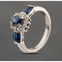 Pre-Owned Platinum 1.26ct Sapphire and 0.17ct Brilliant Cut Diamond Oval Cluster Ring 43361183