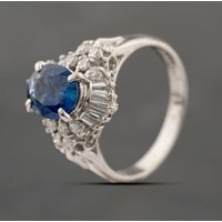 Pre-Owned Platinum Sapphire and 0.47ct Diamond Oval Cluster Ring 43361190