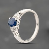 Pre-Owned Platinum 0.79ct Sapphire and 0.10ct Brilliant Cut Diamond Oval Cluster Ring 43361208