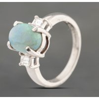 Pre-Owned Platinum 1.85ct Opal and 0.25ct Baguette Cut Diamond Oval Three Stone Ring 43381018