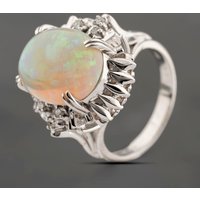 Pre-Owned Platinum 5.50ct Opal and 0.10ct Brilliant Cut Diamond Oval Cluster Ring 43381021