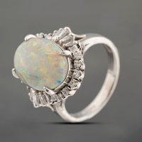 Pre-Owned Platinum 4.91ct Opal and 0.44ct Diamond Oval Cluster Ring 43381035