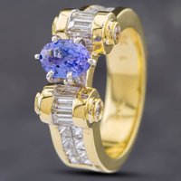 Pre-Owned 14ct Yellow Gold 0.88ct Oval Cut Tanzanite and Diamond Set Shoulders Dress Ring 43411018
