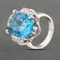 Pre-Owned Platinum 12.43ct Blue Topaz and 0.21ct Brilliant Cut Diamond Oval Dress Ring 43451016